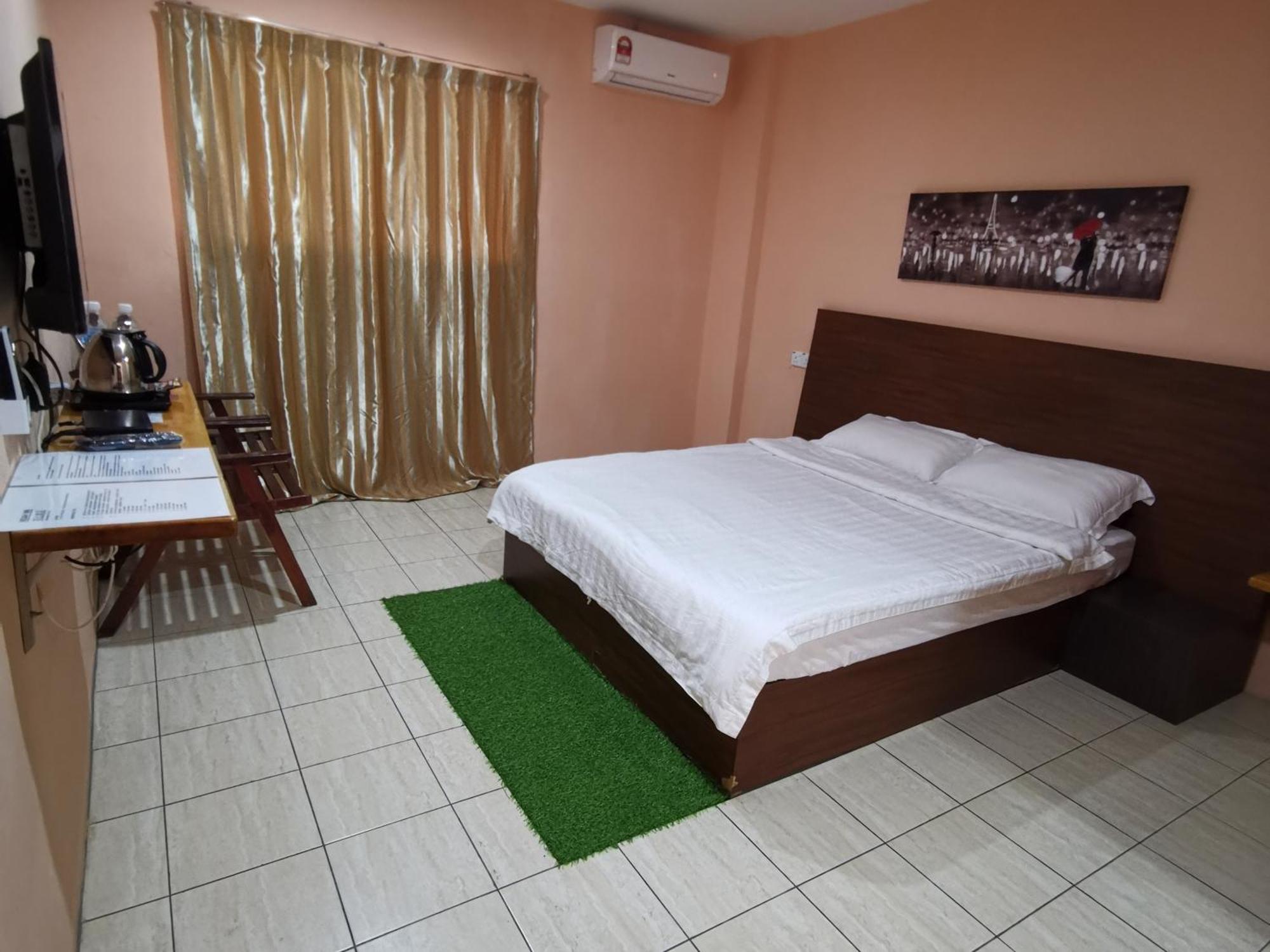 Indah Inn Tawau Værelse billede
